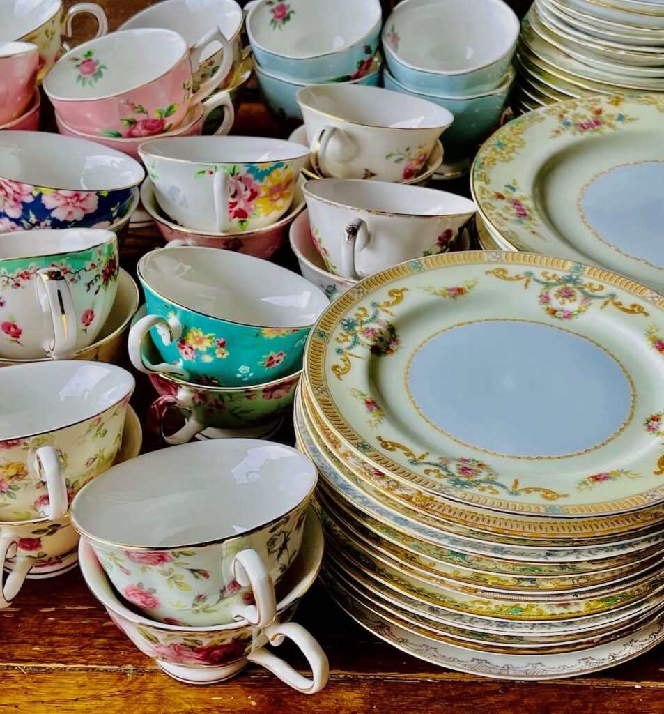 Vintage teacups and plates on a wooden table