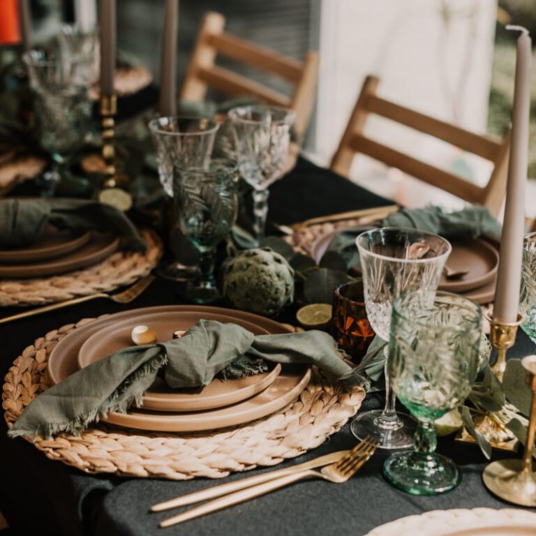Place setting with rattan charger and green napkin