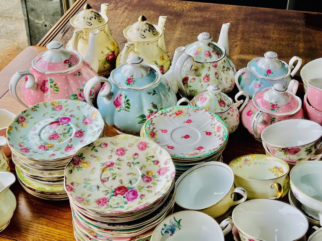 Pastel floral teapots, cups and saucers
